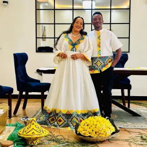 Vibrant Yellow Ethiopian Wedding Outfit: Newly Designed Matching Habesha Couples Outfit